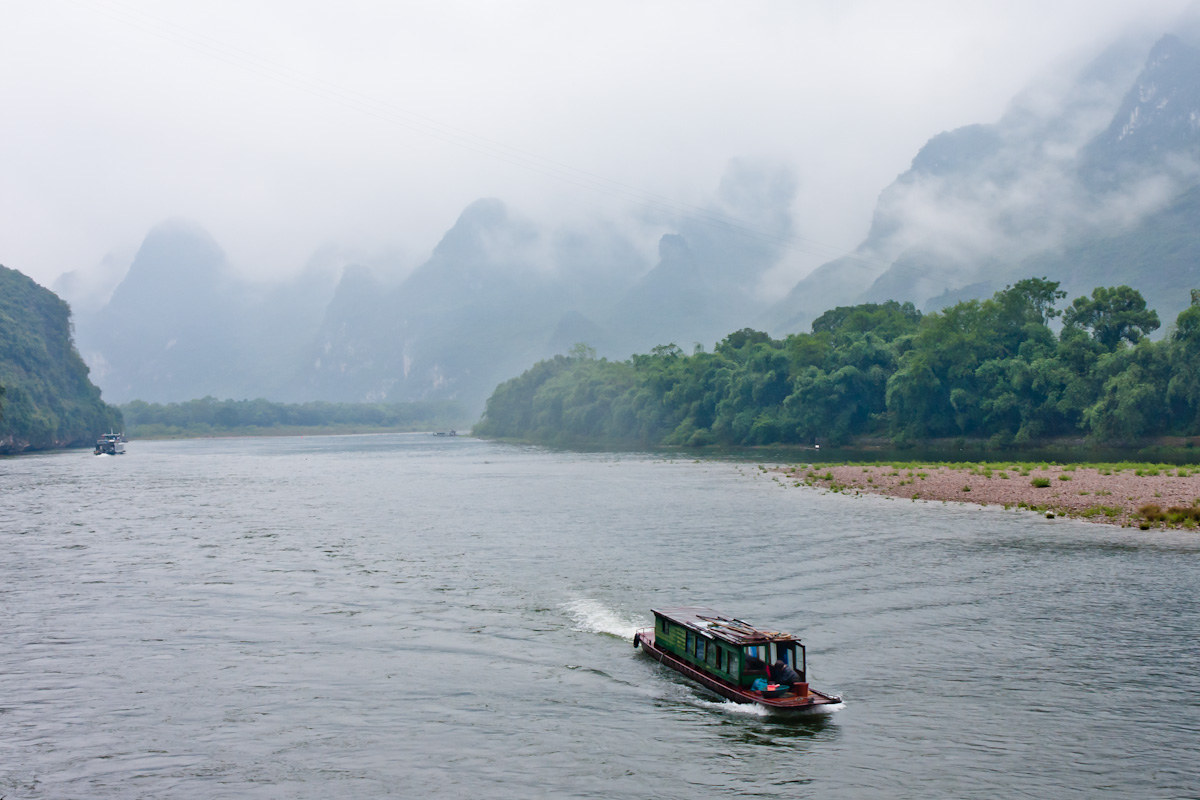 Li River scenery in Guilin with karst mountains and water.